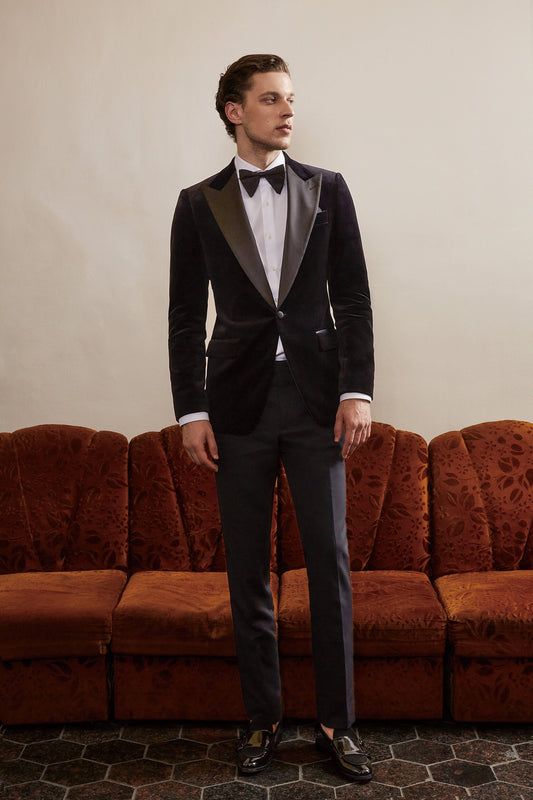 Black velvet wedding tuxedo. Black velvet tux with satin peak lapel and black trousers. Satin covered buttons and satin accents on the pockets on this black velvet formal wedding tuxedo. black velvet tux. formal wedding tuxedo. black tux for groom.
