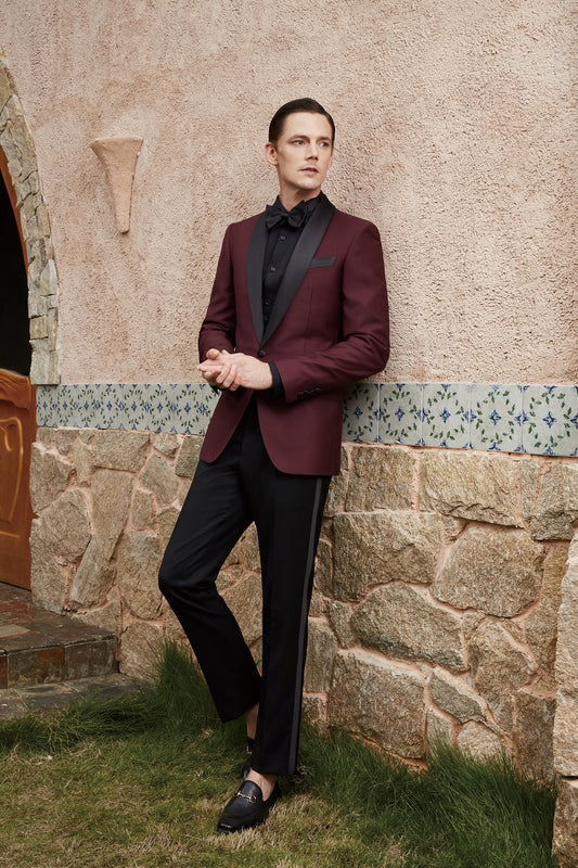 Burgundy tuxedo jacket with black satin shawl lapel. Burgundy vest and pants pictured. Burgundy wedding tuxedo. Groom burgundy suit. Maroon wedding tuxedo. Maroon tux. Burgundy wedding tuxedo. Maroon wedding tux. Formal burgundy tux.
