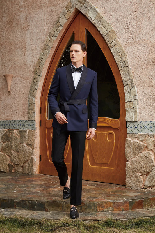 Navy double breasted tuxedo with black shawl satin lapel and black satin belt, black satin jacket cuffs and black satin trim on the pockets. Black trousers to compliment the black satin accents on the tuxedo jacket.