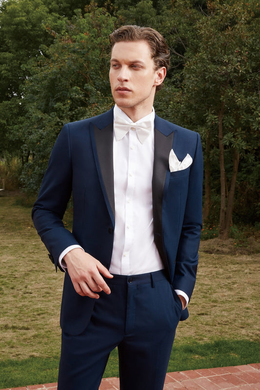 Navy wedding tuxedo with black satin peak lapel. Single breasted navy tux with black satin accents. 2-piece navy wedding tuxedo. Custom navy tuxedo for wedding