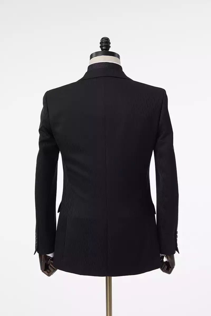 Black wedding suit with notch lapels and an accent vest. Unique design in the fabric. Black suit for groom. Black wedding suit. Groom black wedding suit traditional notch lapel.