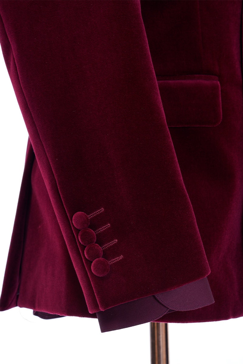 Red velvet tuxedo. Double breasted velvet tuxedo jacket with velvet covered buttons. Dark red maroon velvet tuxedo. Black pants with black satin accent stripe. Velvet wedding tuxedo. Velvet formal tuxedo.
