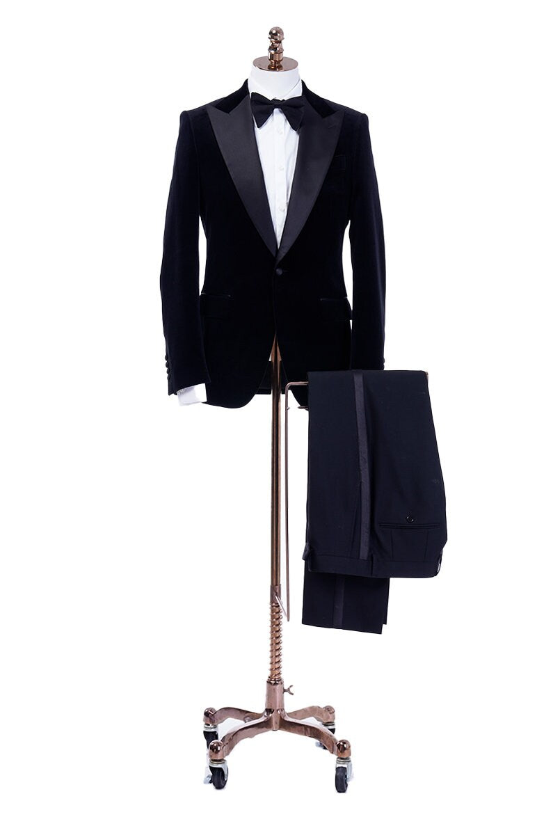 Black velvet wedding tuxedo. Black velvet tux with satin peak lapel and black trousers. Satin covered buttons and satin accents on the pockets on this black velvet formal wedding tuxedo. black velvet tux. formal wedding tuxedo. black tux for groom.