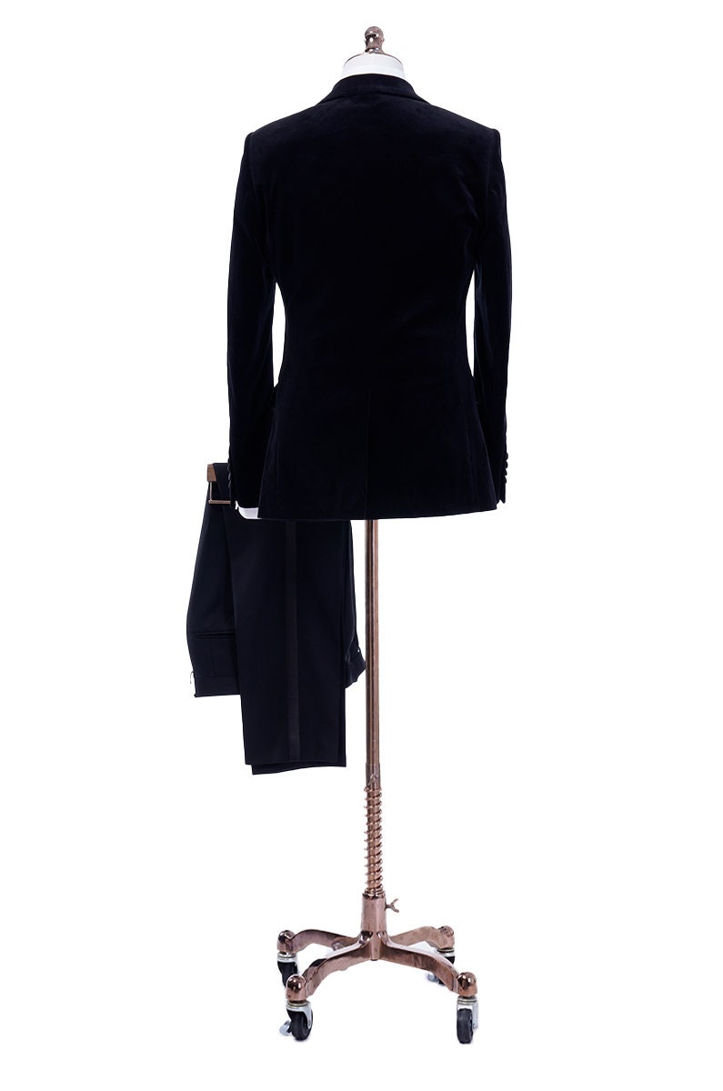 Black velvet wedding tuxedo. Black velvet tux with satin peak lapel and black trousers. Satin covered buttons and satin accents on the pockets on this black velvet formal wedding tuxedo. black velvet tux. formal wedding tuxedo. black tux for groom.