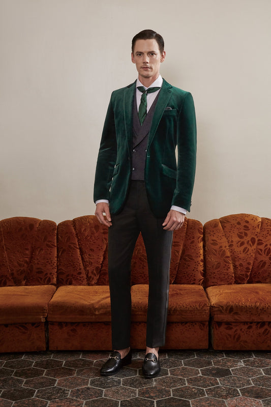 Green velvet tuxedo jacket. Notch lapel with slanted pockets. Black pants with satin accent. Formal green velvet tuxedo jacket. Velvet wedding tuxedo. Velvet smoking jacket. Green velvet tuxedo with satin covered buttons.