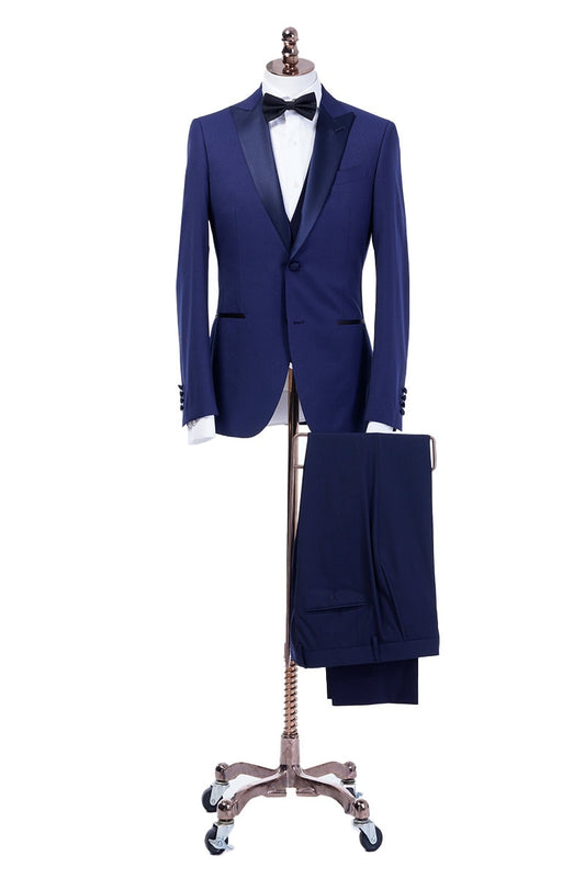 Navy wedding tuxedo with blue satin peak lapel. Single breasted navy tux with blue satin accents. 3-piece navy wedding tuxedo. Custom navy tuxedo for wedding.