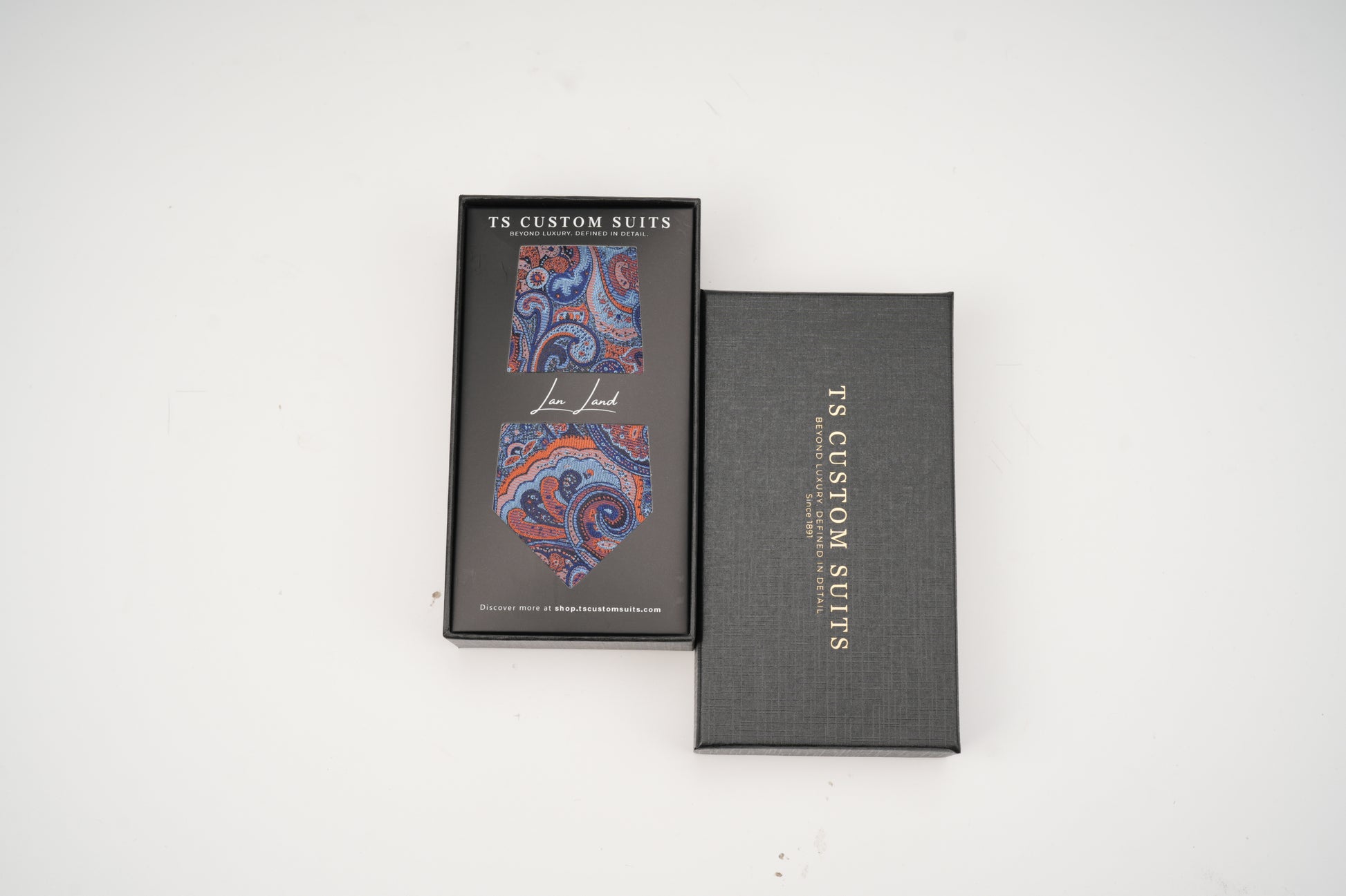 Two gray boxes with a colorful paisley design on a white background