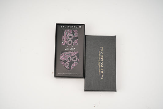 Two gray boxes with paisley design and 'TS Custom Suits' branding on a white background