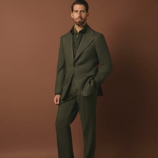 man wearing a green suit
