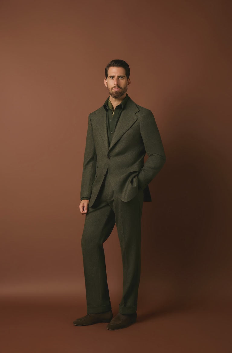 man wearing a green suit