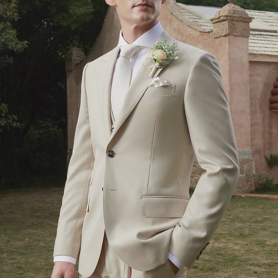 groom wearing a tan wedding suit outside