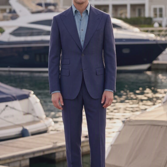 man wearing navy suit at marina