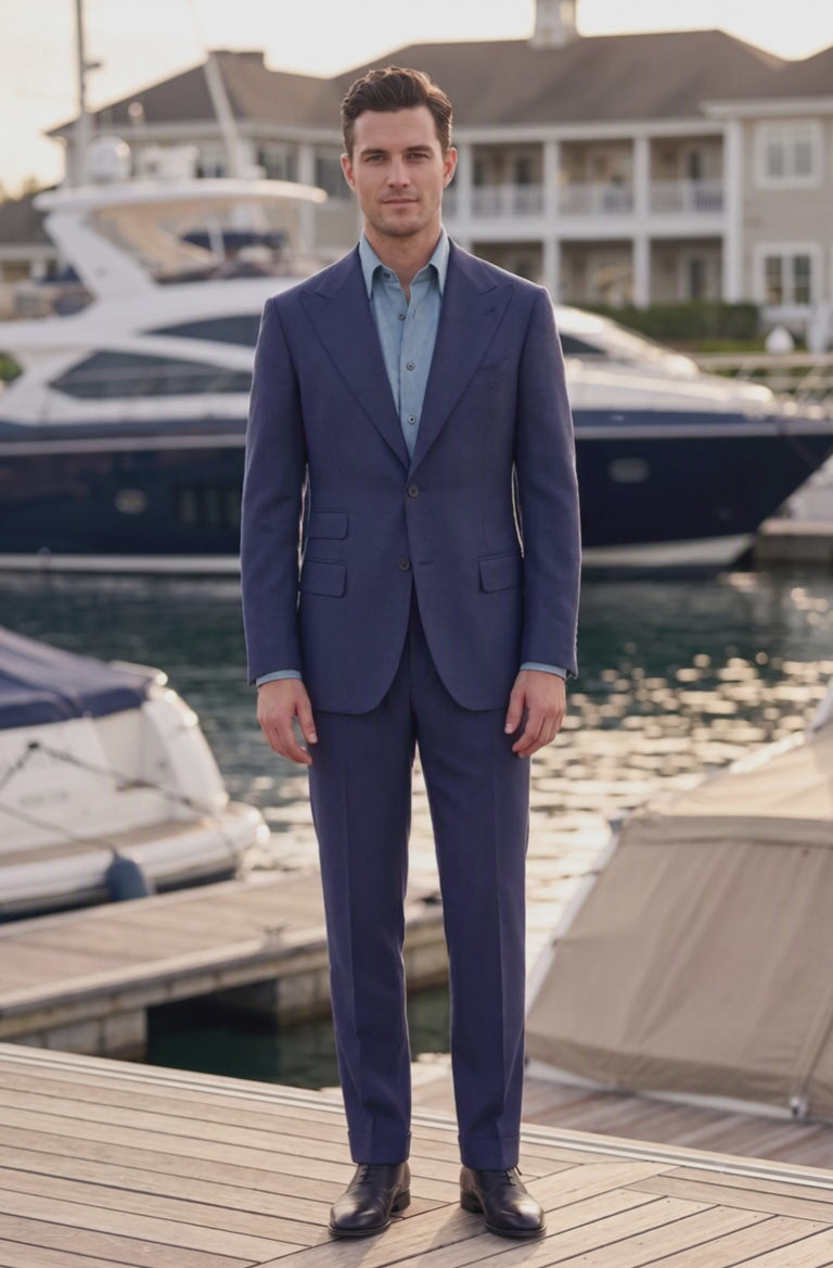 man wearing navy suit at marina